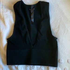 Out from under black crop top